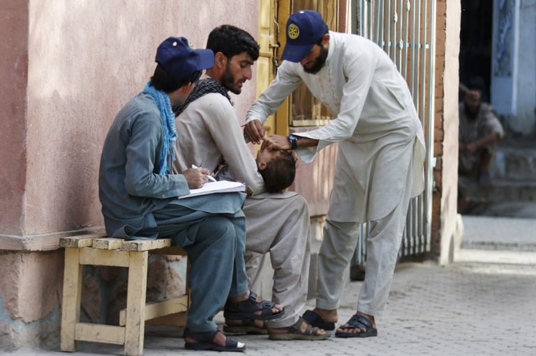 Polio Campaign, Kunar - Afghanistan Afghan permanent transit team vaccinators  gives drops of polio vaccine  for a child as the first day of Polio campaign starts in Asadabad centre of Kunar tense province of Afghanistan, 29 August 2016. WHO/JAWAD JALALI